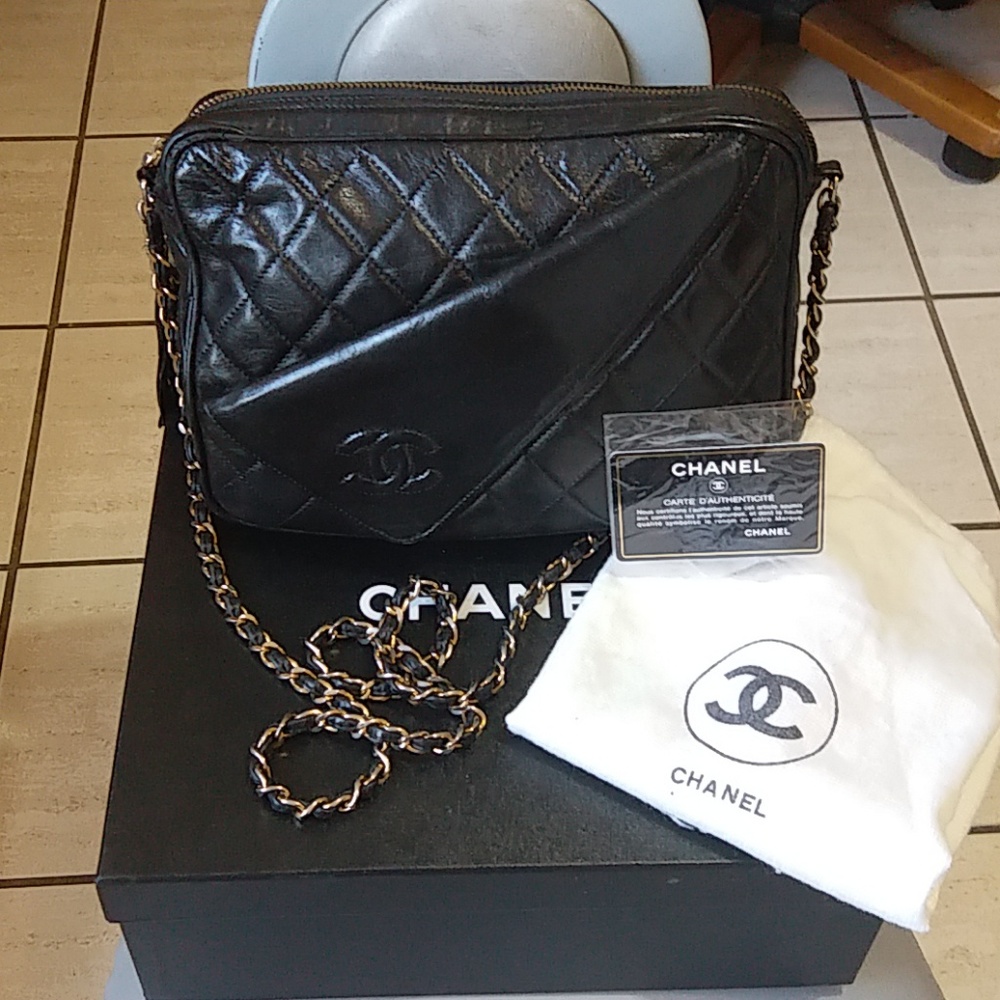 Elegant authentic Chanel vintage camera bag lambsk